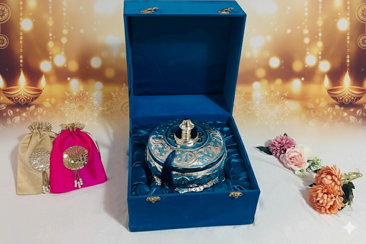Blossom Hampers Royal Azure Box, a silver-toned container with blue enamel and tassel, presented in a plush blue velvet gift box for a luxury gift.